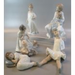 Five Nao Spanish porcelain figurines/figure groups of young girls, a seated ballerina, puppy etc.