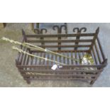 Wrought iron dog grate, together with a set of three brass fire irons. (B.P. 21% + VAT)