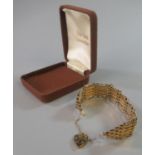 Silver gilt gate bracelet with heart shaped padlock. (B.P. 21% + VAT)