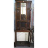 Early 20th Century oak mirror back hallstand of narrow proportions. (B.P. 21% + VAT)