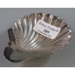 Silver shell shaped pin dish on three ball feet. 1.5 troy ozs approx. (B.P. 21% + VAT)