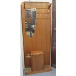 Mid century pale oak mirror back hall stand with shoe rack above. (B.P. 21% + VAT)