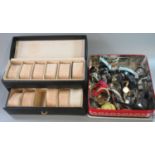 Tin of assorted modern watches, together with a padded watch collectors box. (2) (B.P. 21% + VAT)