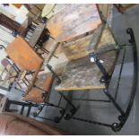 Two similar large rustic wrought iron open arm garden rocking chairs, with solid wooden back and
