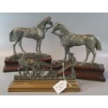 Pair of white metal horse shaped door stops or hearth ornaments and another similar white metal