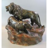 Early 20th century bronzed study of a male and female lion on naturalistic base. (B.P. 21% + VAT)