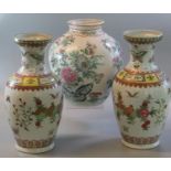 Pair of Chinese post Republic porcelain polychrome decorated baluster vases, overall decorated