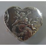 Continental silver heart shaped pill box with repoussé cherub decoration. Impressed marks. 0.8