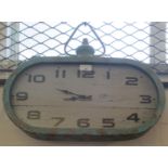 Unusual vintage style oval shaped wall clock with later quartz movement. (B.P. 21% + VAT)