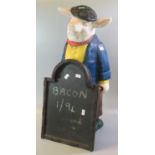 Butchers advertising painted pottery pig holding a board. 56cm high approx. (B.P. 21% + VAT)