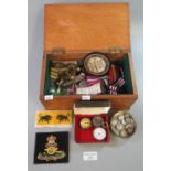 Oak box containing a collection of military interest items to include; various watches, medal