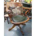 Early 20th century oak framed spindle back captains/office swivel chair on a leather seat. (B.P. 21%