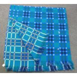 Vintage Welsh woollen tapestry blue ground blanket with fringed edges and 'Made in Wales, a Derw