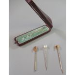 15ct gold horseshoe seed pearl set stick pin, another pearl stick pin and a 9ct gold stone set stick