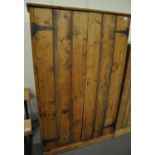 Early 20th century pine two door blind panel cupboard, the interior revealing four fitted