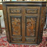 Chinese carved hardwood buffet having hinged lid with carved ornate panels of figures and boats in a