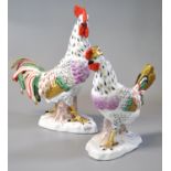 Pair of early 20th Century porcelain hand painted figures of a cockerel and hen, both on