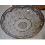 Large Indian copper tray overall with central foliate medallion surrounded by figures in an