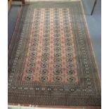 Middle eastern design peach ground geometric carpet, the centre repeating gull design. 155x250cm