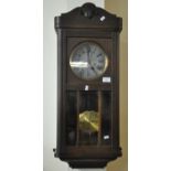 Mid century oak two train wall clock with brass pendulum and key. (B.P. 21% + VAT)