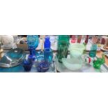 Two trays of coloured glass ware, to include: various shapes and colours of vases, mainly green