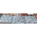 Three trays of glassware to include: pedestal dessert bowls, various drinking vessels, Stuart