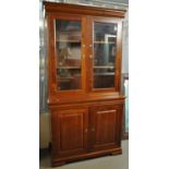 Modern cherry wood cabinet back glazed two door bookcase with two cupboards to the base on bracket