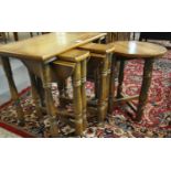 Mid century oak side table, having three pullout drop leaf type tables, standing on wheels. (B.P.