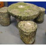 Modern weathered garden table with four matching stools all in the form of tree stumps. (B.P.