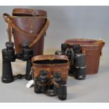 Three pairs of vintage binoculars, all in leather cases, to include: Denhill, Telex and a military