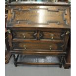 Early 20th century oak Jacobean style fall front bureau having two long drawers on barley twist