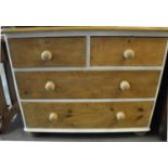 Later Victorian pine straight front chest of two short and two long drawers having knob handles on