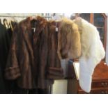 Three vintage fur items: one cream coloured rabbit fur stole, a fox fur stole and a dark brown 3/4
