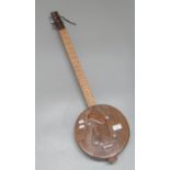 Folk art design wooden three string American guitar. (B.P. 21% + VAT)