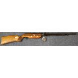 Mid century air rifle, marked 'Foreign' with a tin box of pellets. (B.P. 21% + VAT)
