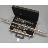 Cased Boosey & Hawkes Regent clarinet in fitted box, together with a silver plated flute. (B.P.