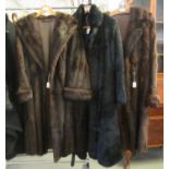 Three vintage fur coats: one black coney or rabbit fur with belt, two dark brown; one with CC41