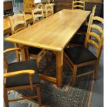 Modern pine kitchen table. 246x82x78cm approx. Together with a set of eight pine ladder back
