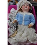 Early 20th century German bisque headed doll with glass eyes and painted features, probably '