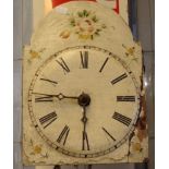 19th century painted cottage faced wall clock with Roman numerals and floral sprays with various