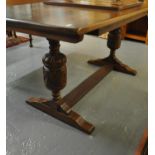 Early 20th century oak refectory type table on baluster turned carved logs and central stretcher. (