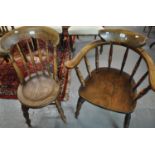 Early 20th century elm smoker's bow chair together with another early 20th century elm spindle