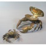 Novelty brass single inkwell in the form of a crab, with ceramic liner. Together with another