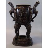 Japanese patinated bronze Koro, having winged bird mounts and relief floral panels on cabriole