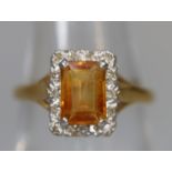 18ct gold ring set with a yellow stone and diamonds. Ring size L & 1/2. Approx weight 3.2 grams. (