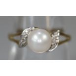 9ct gold cultured pearl and diamond ring. Ring size O. Approx weight 1.9 grams. (B.P. 21% + VAT)