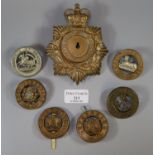 Various military cap badges including East Yorkshire, East Lancashire, Royal Jersey Light