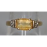 9ct gold yellow stone and diamond ring. Ring size P. Approx weight 2.2 grams. (B.P. 21% + VAT)