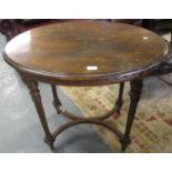 Edwardian mahogany occasional table of oval form standing on tapering fluted legs. (B.P. 21% + VAT)