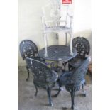 Modern weathered metal pierced garden table with four matching chairs, together with another